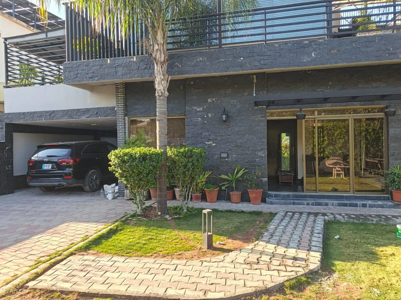 Finished slate-clad facade after renovation